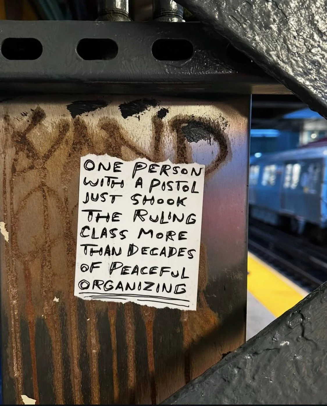 One person with a pistol just shook the ruling class more than decades of peaceful organizing. Photo taken inside a rusty wall in the subway